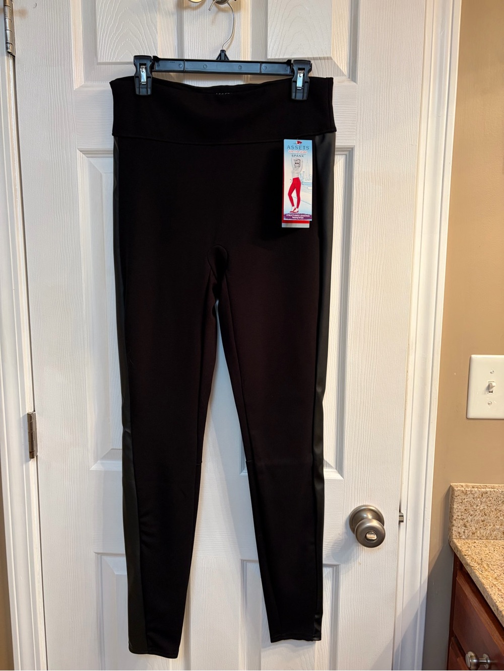 SPANX Black High-Waist Women’s structured Leggings with leather-like panels.